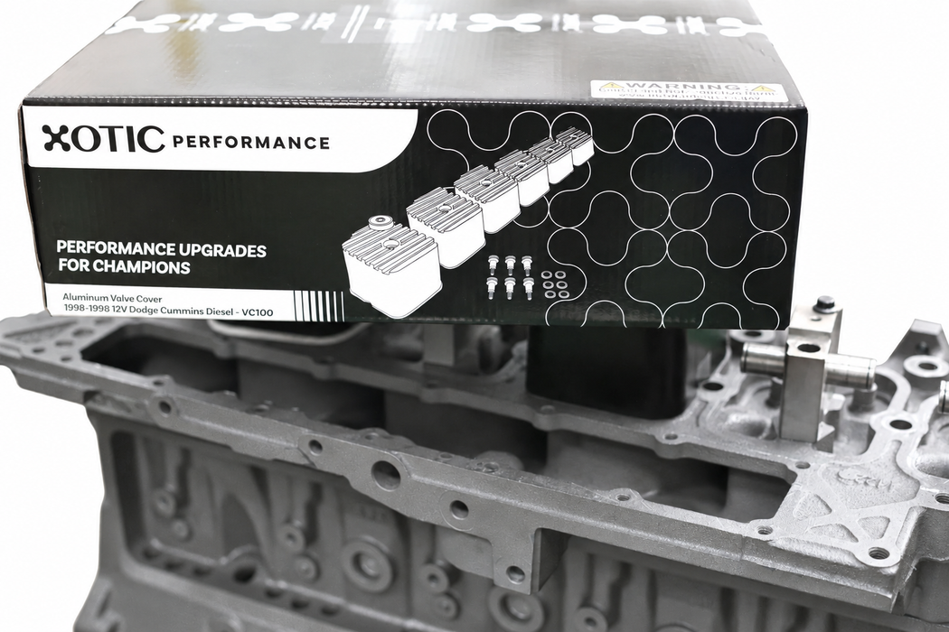 Valve-cover packaging displayed above a grey Cummins engine — gallery photo 7