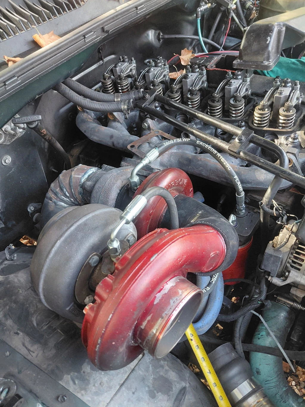 Kevin Burnett’s Cummins engine with exposed rocker arms and red compound turbochargers
